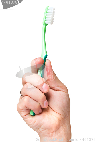 Image of Hand with toothbrush on white 