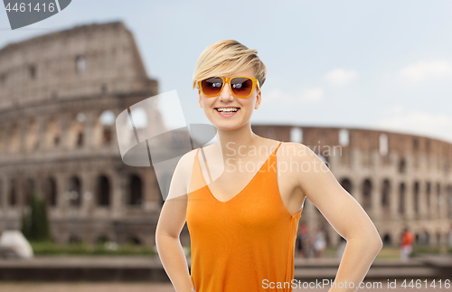 Image of happy smiling teenage girl over coliseum