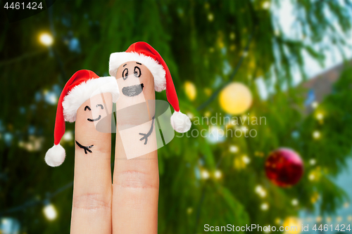 Image of close up of finger couple over christmas tree