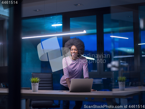 Image of black businesswoman using a laptop in startup office