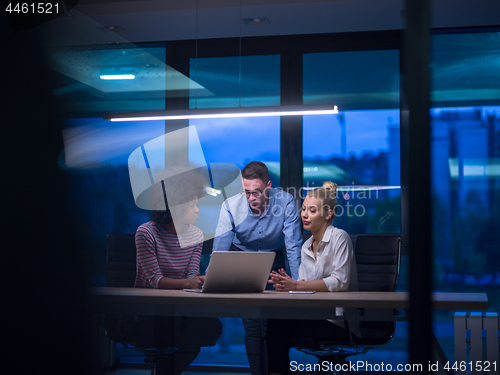 Image of Multiethnic startup business team in night office