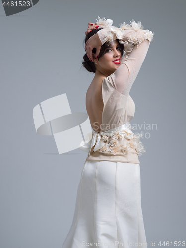 Image of Rear view of a beautiful young woman in a wedding dress