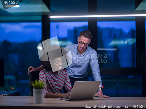 Image of Multiethnic startup business team in night office