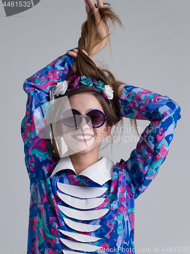 Image of woman posing in fashionable clothes and sunglasses