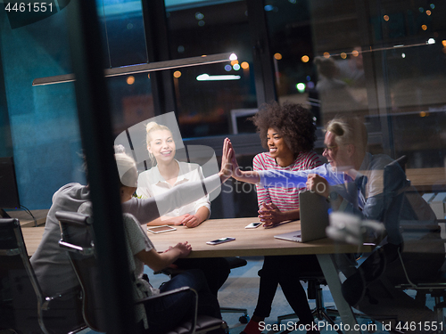 Image of Multiethnic startup business team in night office