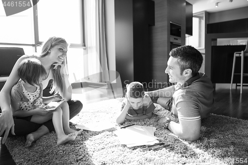 Image of young couple spending time with kids