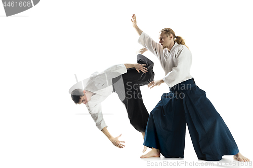 Image of The two men fighting at Aikido training in martial arts school