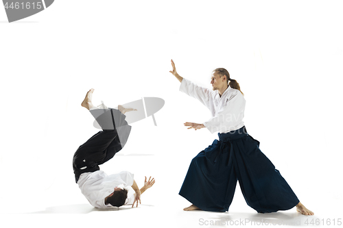 Image of The two men fighting at Aikido training in martial arts school