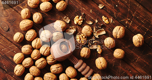 Image of Nutcracker and nuts lying on table