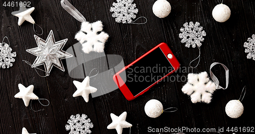 Image of Christmas decorations and smartphone