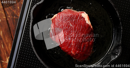 Image of Big piece of meat on pan