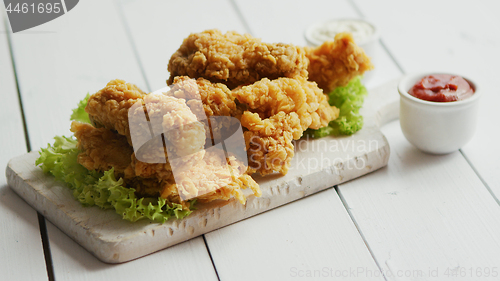 Image of Fried meat laid on chopping board