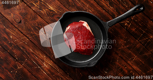 Image of Piece of meat laid on pan
