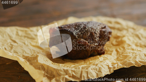 Image of Piece of roasted meat on parchment