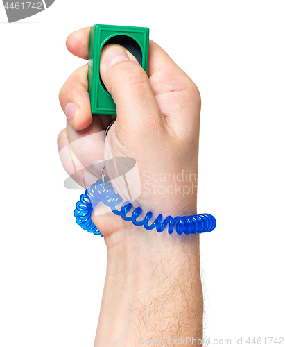 Image of Hand with dog clicker on white