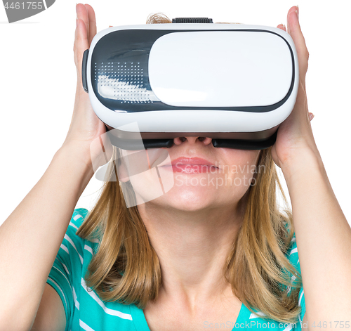 Image of Woman looking in VR glasses