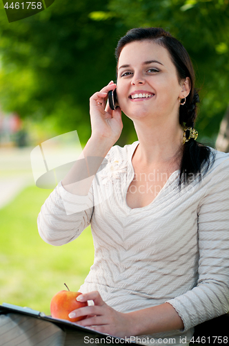 Image of Young woman outdoors