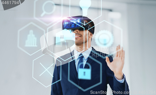 Image of businessman with virtual reality headset at office