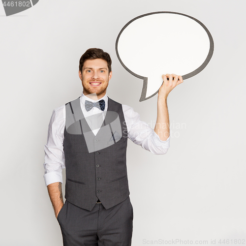 Image of happy man in suit holding blank text bubble banner