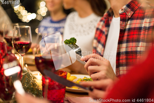 Image of close up of friends having christmas dinner