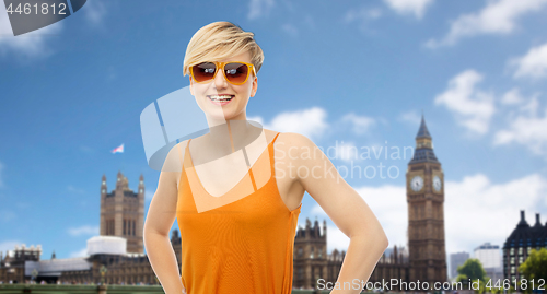 Image of teenage girl over houses of parliament in london