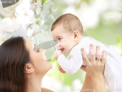 Image of mother with baby over cherry blossom background