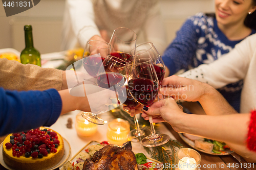 Image of close up of friends with wine celebrate christmas