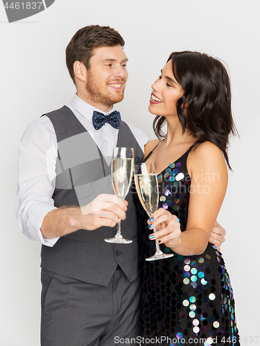 Image of happy couple with champagne glasses at party