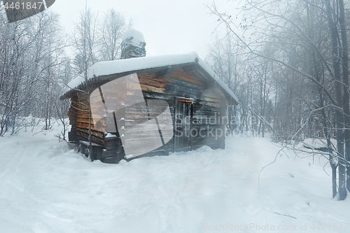 Image of Winter Snowy Landscape with Log Cabin