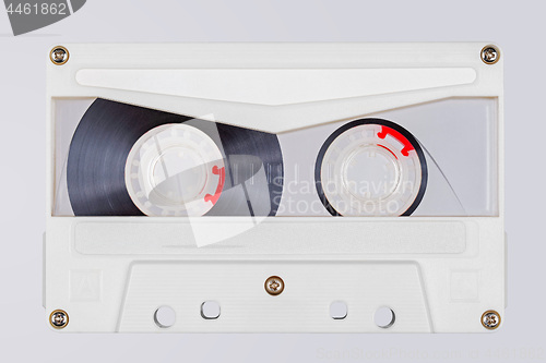 Image of Retro white transparent audio tape isolated on white background.