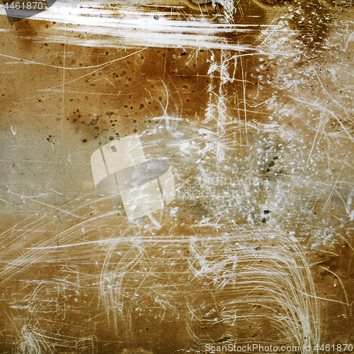 Image of Brown grunge textured background with scratches and grain.