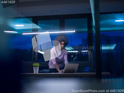 Image of black businesswoman using a laptop in startup office