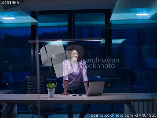 Image of black businesswoman using a laptop in startup office