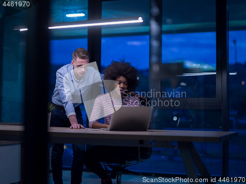 Image of Multiethnic startup business team in night office