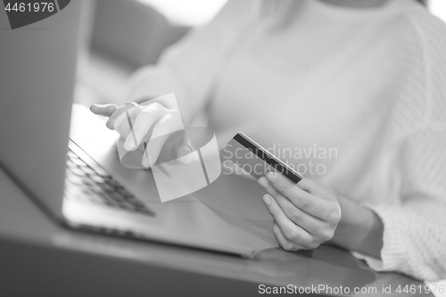 Image of woman  shopping  Online