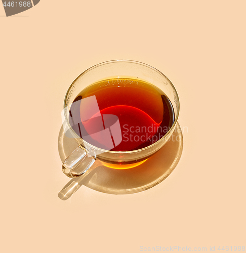 Image of cup of tea with long shadow