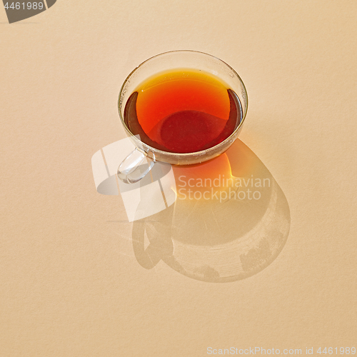 Image of cup of tea with long shadow