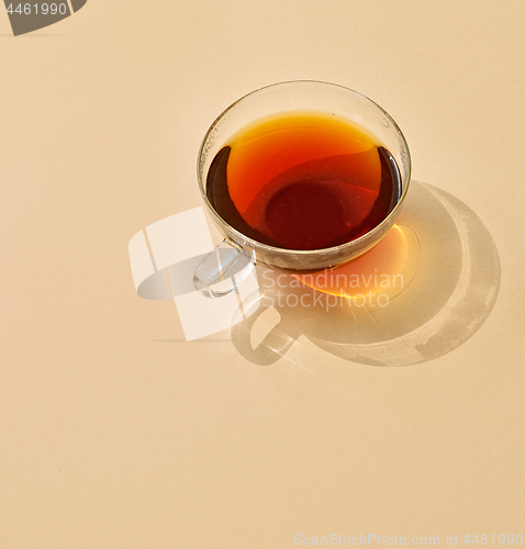 Image of cup of tea with long shadow