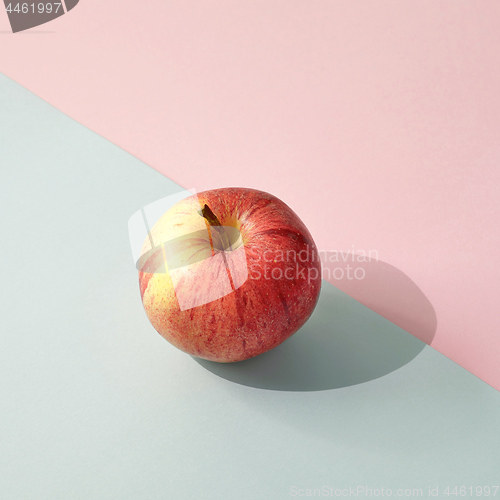 Image of fresh apple on colored paper background