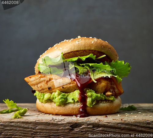Image of burger with chicken meat and avocado