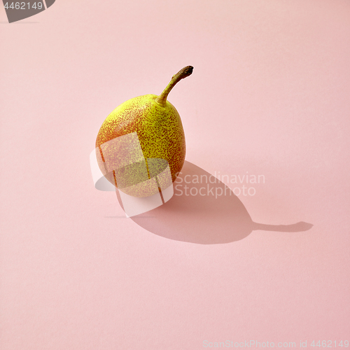 Image of fresh pear with long shadow