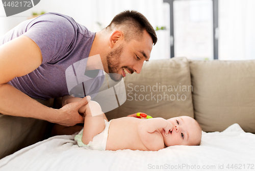 Image of close up of father with little baby at home