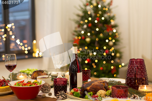 Image of food and drinks on christmas table at home