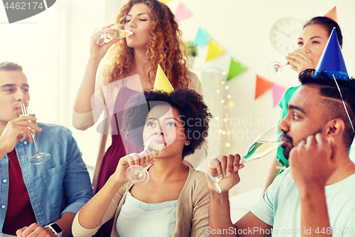 Image of team drinking champagne at office birthday party