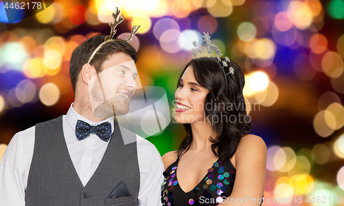 Image of couple with christmas or new year party props