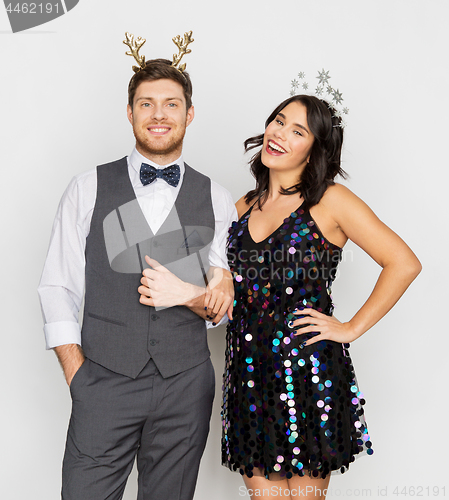 Image of couple with christmas or new year party props