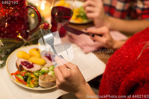 Image of close up of woman having christmas dinner