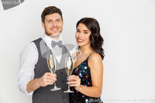 Image of happy couple with champagne glasses at party