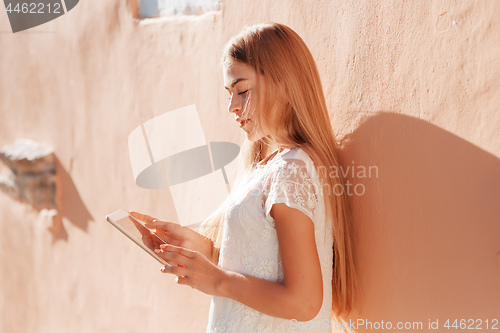 Image of Beautiful urban woman taking picture of herself