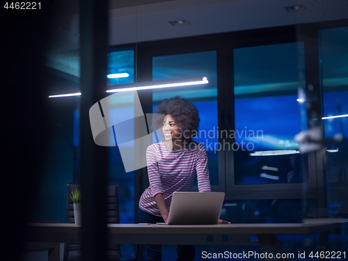 Image of black businesswoman using a laptop in startup office